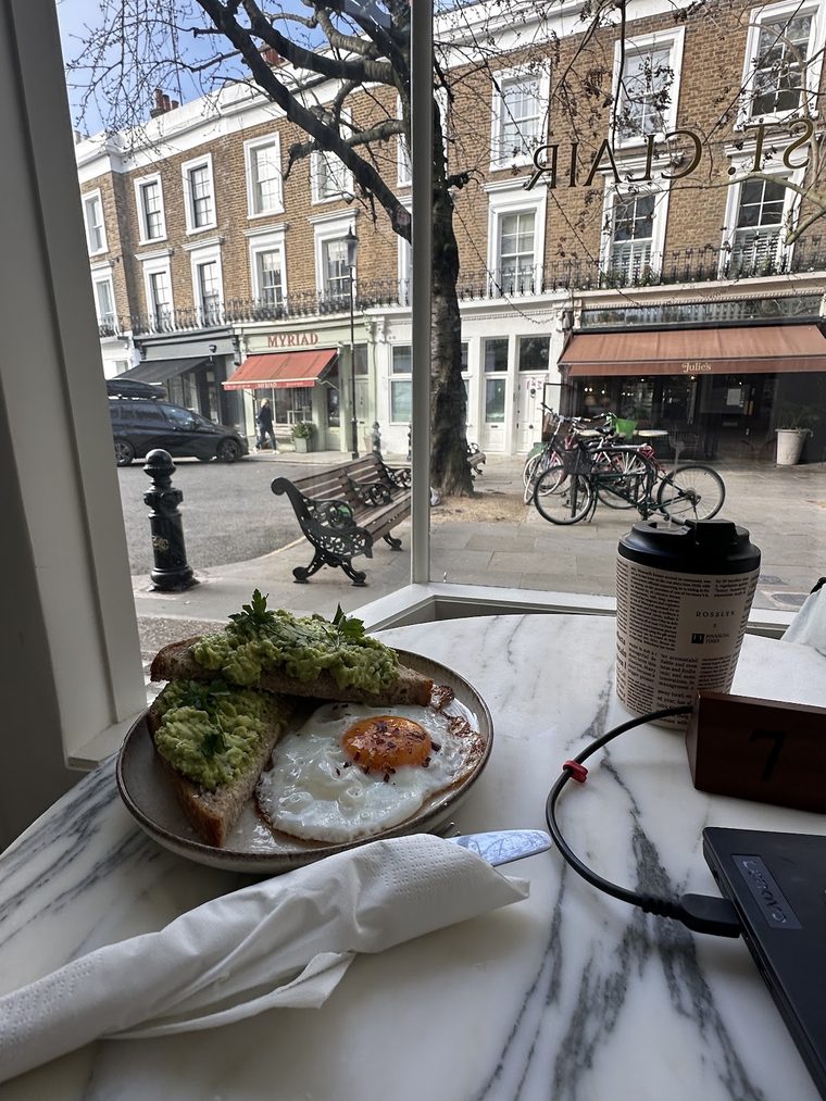 Avocado toast topped with a poached egg.